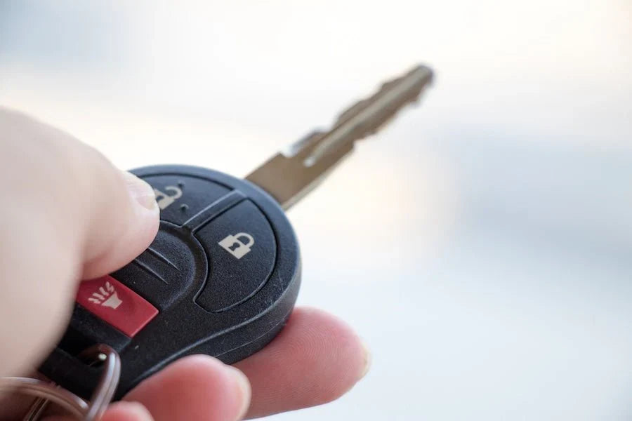 Factory key fob used to remote start a vehicle with Compustar OEM Style 3X lock start